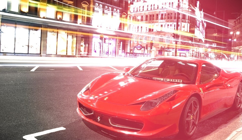 Red Ferrari Parked on the Street
