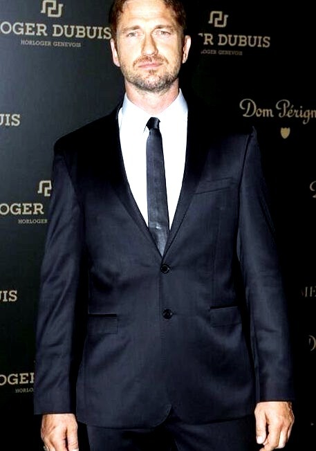 GerardButler donning a Boss Mens suit during Art Basel in Miami, Floridawww.DiscoverLavish.com