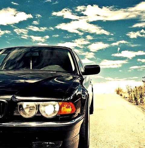 BMW on a summer roadwww.DiscoverLavish.com